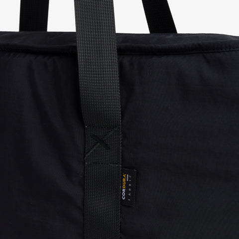 X logo on strap of Tech Tote Bag - Black