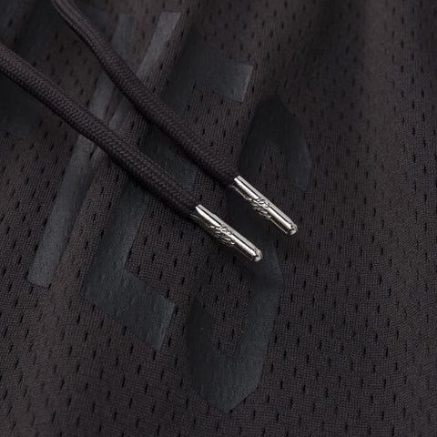 drawstring metal tip detail on 100 thieves logo on Foundations SS'24 Mesh Short - Graphite