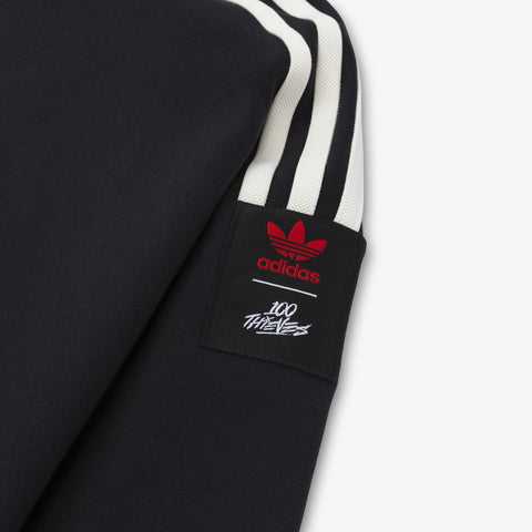 Combo logo on sleeve of adidas Originals SS’24 1/2 Zip