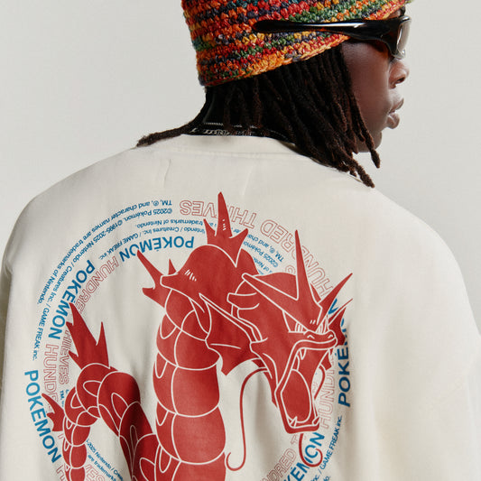 Model in Gyarados Crewneck - Cream