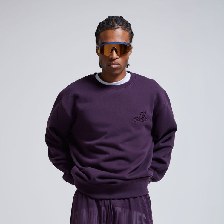 Model in Foundations SS'24 crewneck and shorts in plum.