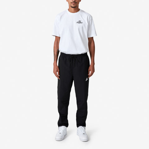 100 Thieves Foundation nylon pants with elastic waistband and 100 Thieves metal aglet tipped drawstrings in the color black