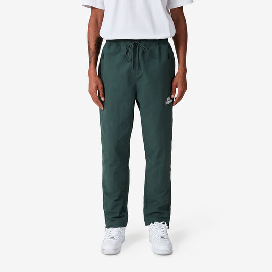 100 Thieves Foundation nylon pants with elastic waistband and 100 Thieves metal aglet tipped drawstrings in the color alpine