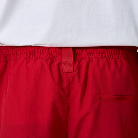 red detail in back of 100 Thieves Foundation nylon pants in the color red