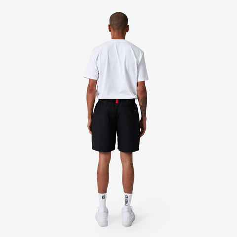 back of 100 Thieves Foundations nylon short with extra wide elastic waistband and 100 Thieves metal aglet tipped drawstrings in color black.