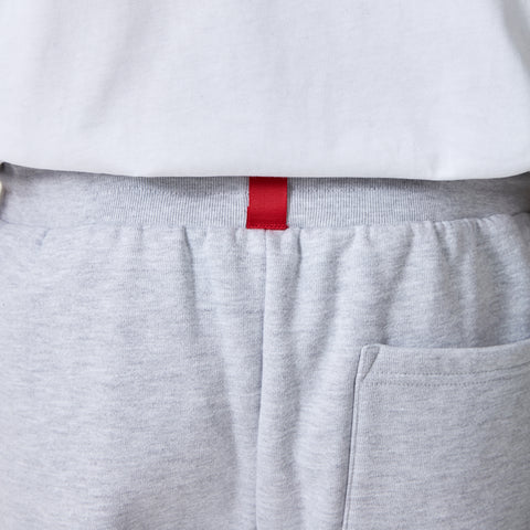 red tag on back of 100 Thieves Foundation slim fit sweatpant in grey