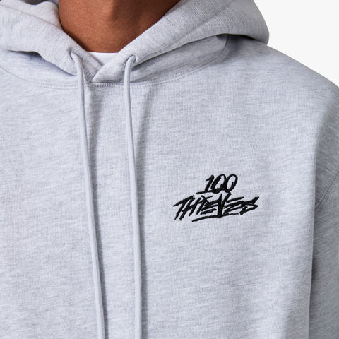 100 Thieves logo embroidered on left side of 100 Thieves Foundation heavyweight grey fleece hoodie