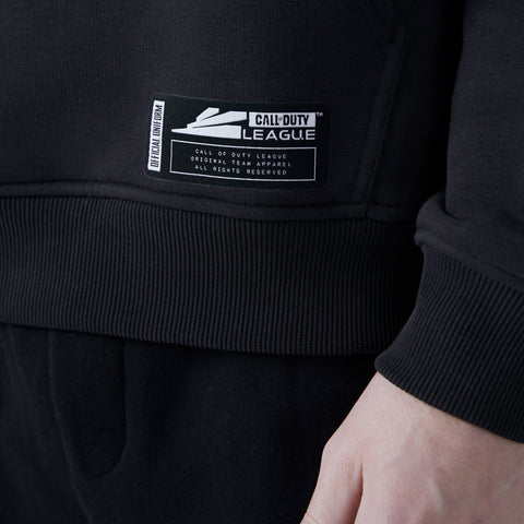 Call of Duty League patch located on bottom left of LA Thieves with the official player kit hoodie in home colors