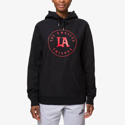classic heavyweight fleece hoodie with LA Thieves logo on front. On female model